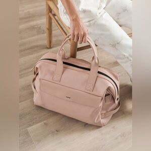 calpak laptop hue duffel in pink sand